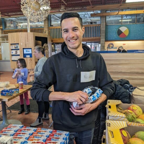 man volunteering to pack food for charity organization